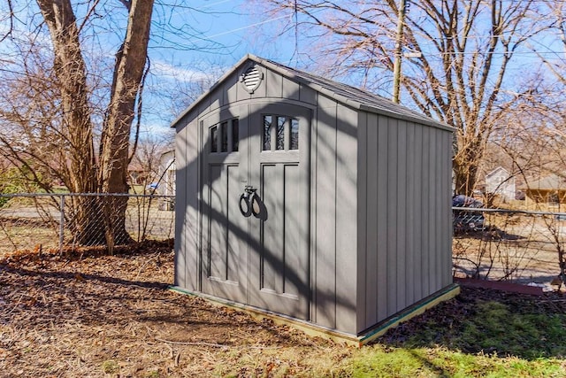 view of shed with fence