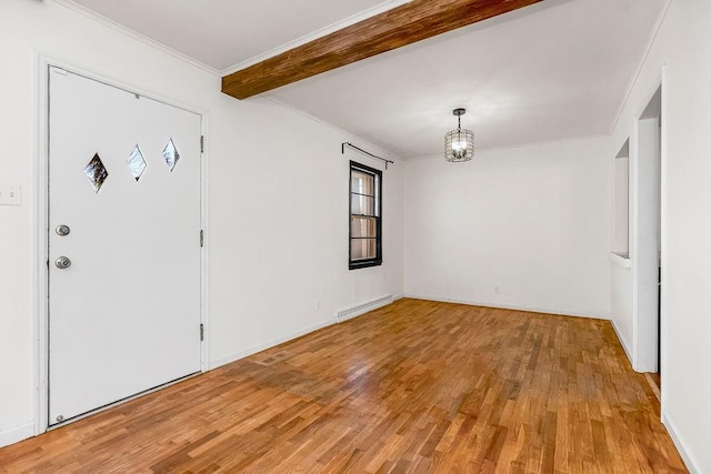 entrance foyer featuring light wood-style flooring, a notable chandelier, a baseboard heating unit, beamed ceiling, and crown molding