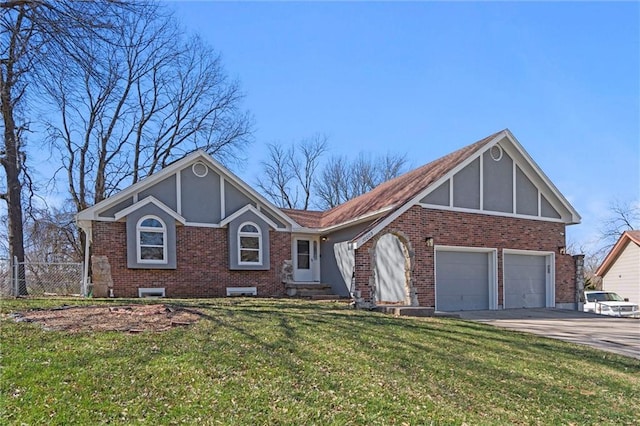 tudor home with brick siding, driveway, a front lawn, and fence