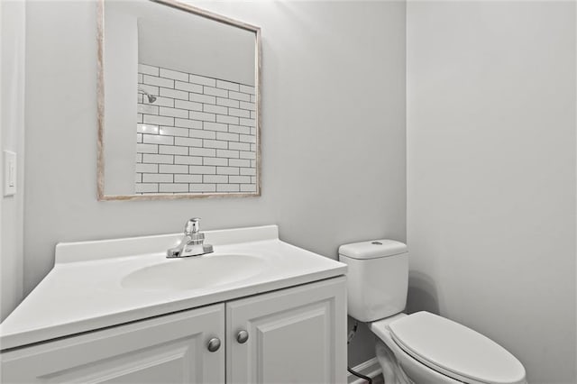 bathroom with toilet and vanity