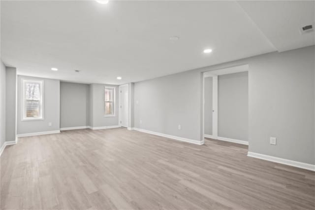 interior space featuring recessed lighting, visible vents, baseboards, and light wood-style floors