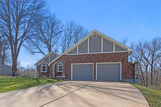 10009 E 56th Ter, Raytown, MO 64133 - tudor home featuring driveway, brick siding, and stucco siding