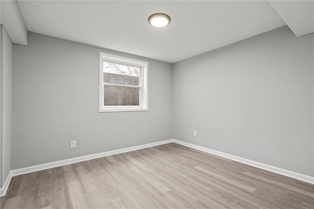 10009 E 56th Ter, Raytown, MO 64133 - unfurnished room featuring wood finished floors and baseboards