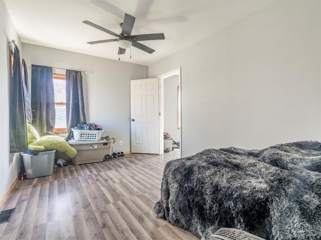 bedroom featuring ceiling fan and light hardwood / wood-style flooring