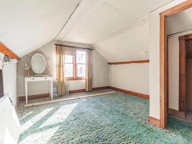 bonus room featuring vaulted ceiling and carpet flooring