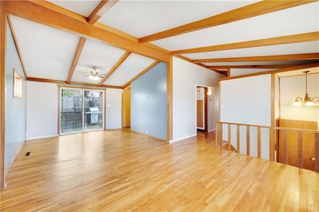 empty room featuring vaulted ceiling with beams, ceiling fan with notable chandelier, and light hardwood / wood-style flooring