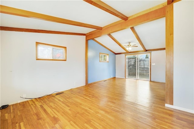 spare room with ceiling fan, vaulted ceiling with beams, and light hardwood / wood-style floors