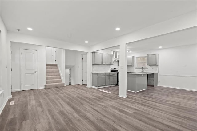 unfurnished living room featuring hardwood / wood-style flooring