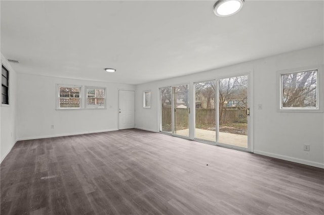 spare room with dark hardwood / wood-style flooring