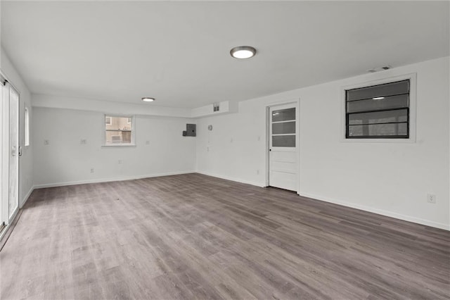 unfurnished room with wood-type flooring