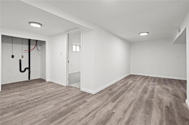 basement featuring light wood-type flooring