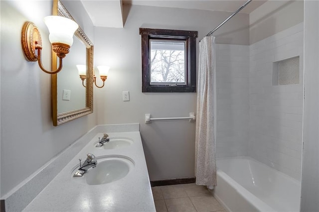 bathroom featuring tile patterned flooring, dual sinks, and shower / tub combo with curtain