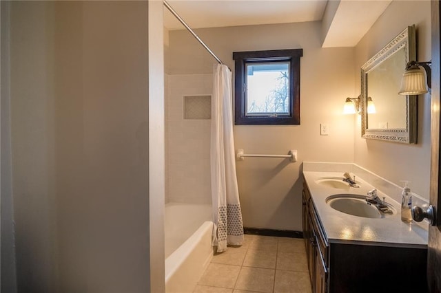 bathroom with shower / tub combo with curtain, tile patterned floors, and vanity