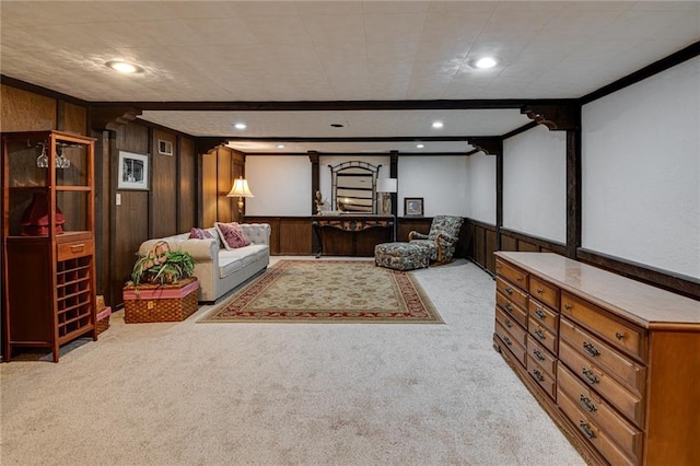 carpeted living room with wooden walls