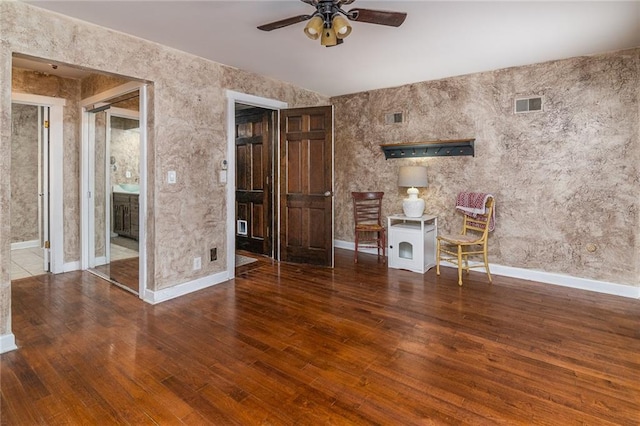 interior space featuring dark hardwood / wood-style floors and ceiling fan