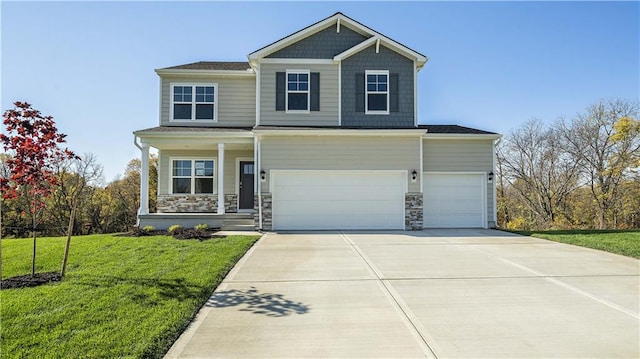 view of front of property with a porch, a garage, and a front yard