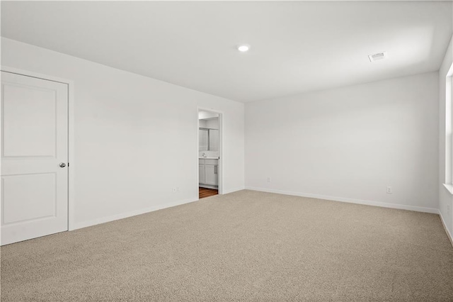 unfurnished room with carpet floors