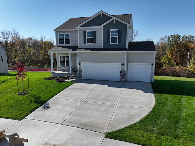 view of front of property featuring a garage and a front yard