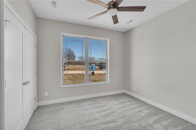 unfurnished bedroom featuring carpet, visible vents, and baseboards