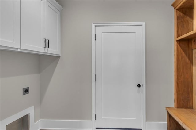 laundry area featuring cabinet space and hookup for an electric dryer