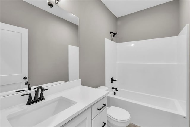 bathroom featuring shower / bathing tub combination, vanity, and toilet