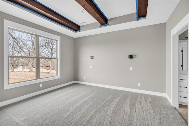 1112 Old Time Dr, Excelsior Springs, MO 64024 - carpeted spare room featuring baseboards and beamed ceiling