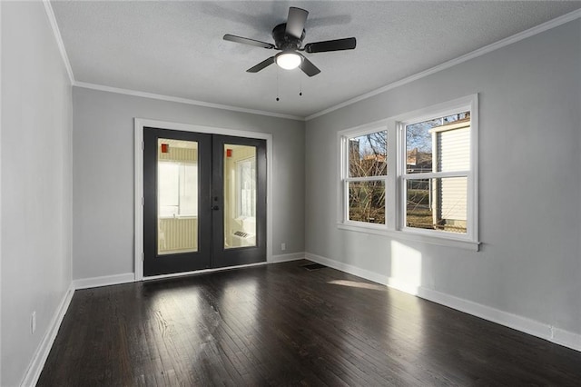 spare room with crown molding, ceiling fan, a textured ceiling, dark hardwood / wood-style flooring, and french doors