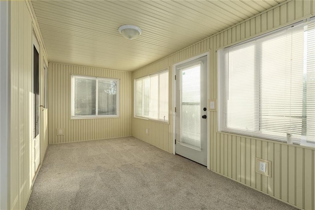 unfurnished sunroom featuring plenty of natural light