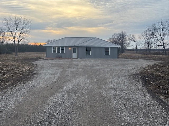 1202 NW County Road 6001, Butler, MO 64730 - view of front of home with gravel driveway and metal roof