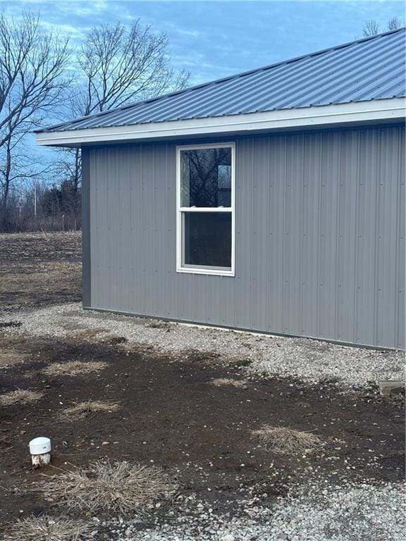 1202 NW County Road 6001, Butler, MO 64730 - view of side of home featuring metal roof