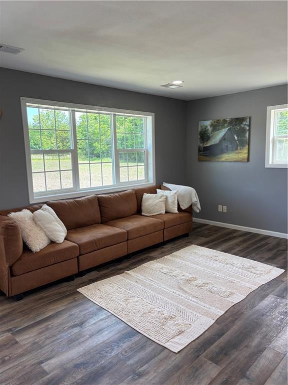 1202 NW County Road 6001, Butler, MO 64730 - living area featuring wood finished floors and baseboards