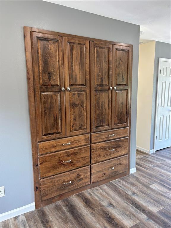 1202 NW County Road 6001, Butler, MO 64730 - detailed view of baseboards and wood finished floors