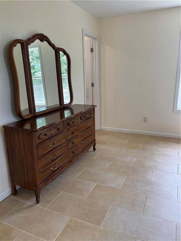 1202 NW County Road 6001, Butler, MO 64730 - bedroom featuring baseboards