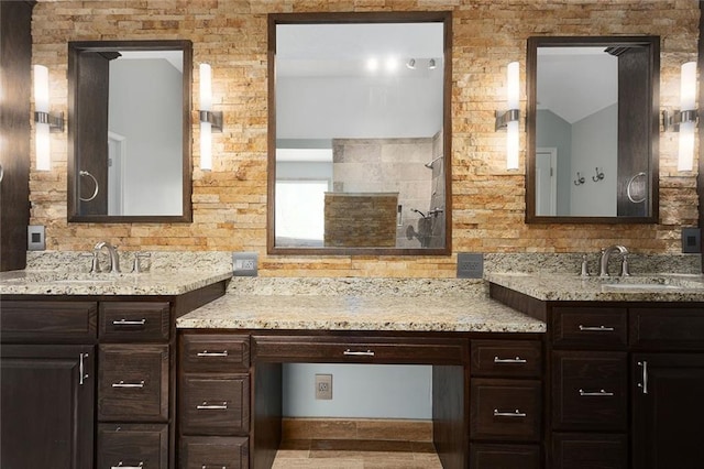 full bathroom with walk in shower and vanity