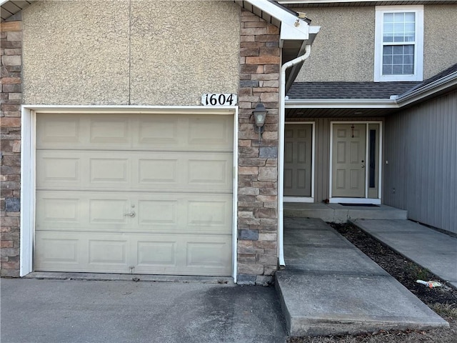 view of exterior entry featuring a garage