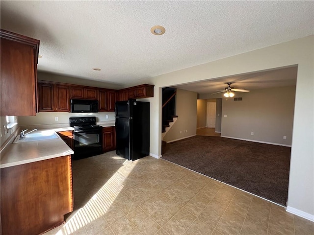 kitchen with sink, light colored carpet, a textured ceiling, ceiling fan, and black appliances