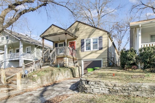 view of front facade with a porch and a garage