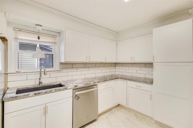 kitchen featuring stainless steel dishwasher, sink, and white cabinets