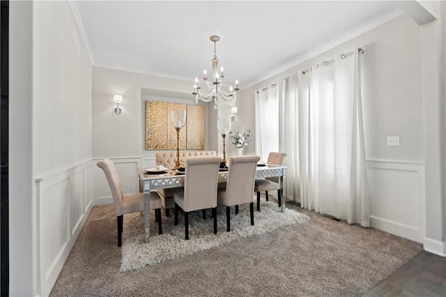 dining space featuring an inviting chandelier and crown molding