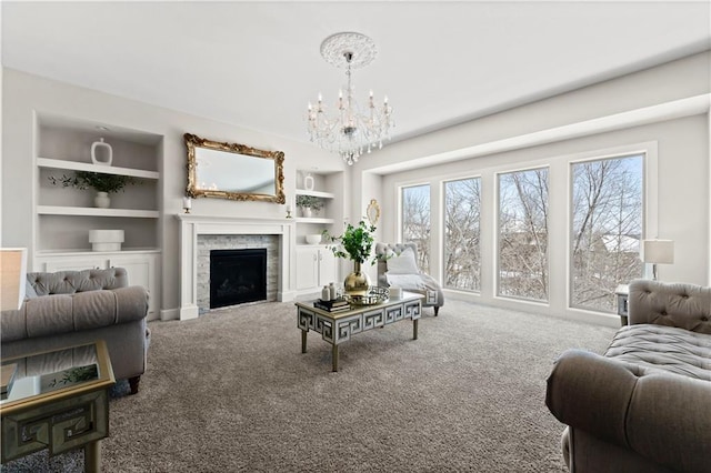 living room with built in shelves, carpet floors, and a wealth of natural light