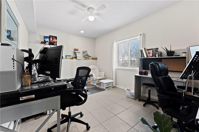 tiled office space featuring ceiling fan