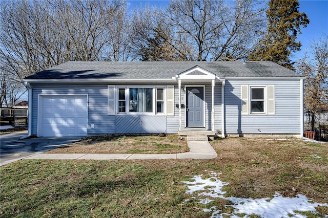 single story home with a shingled roof, driveway, and an attached garage