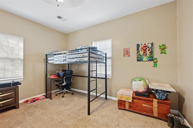 bedroom with light colored carpet and ceiling fan