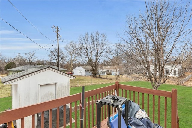 deck featuring a yard and a shed