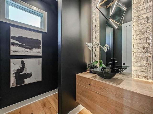 bathroom with hardwood / wood-style flooring and vanity