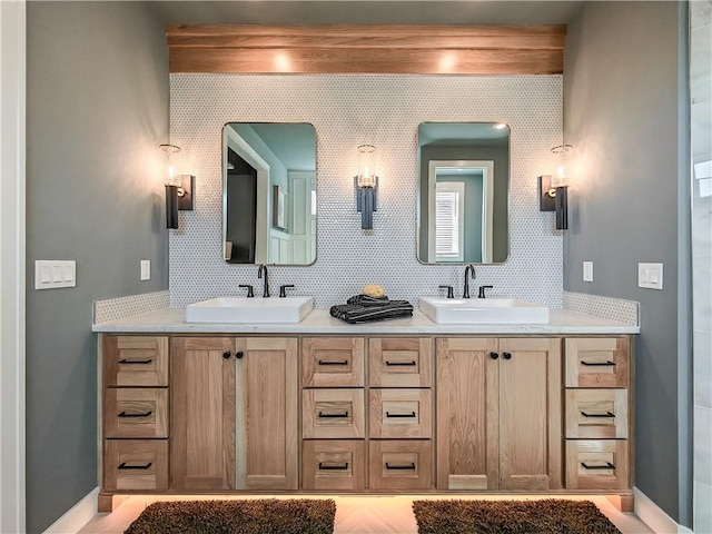 bathroom with vanity and decorative backsplash