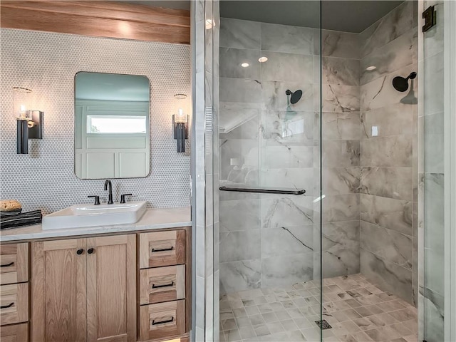 bathroom with vanity and a shower with shower door