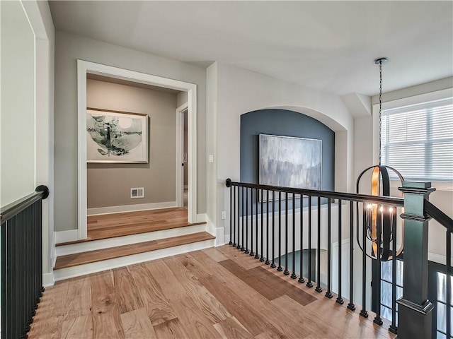 corridor with light hardwood / wood-style flooring