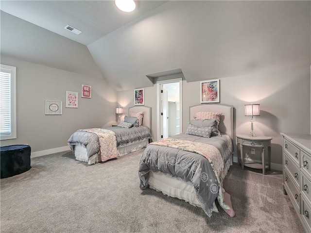 bedroom with lofted ceiling and dark carpet