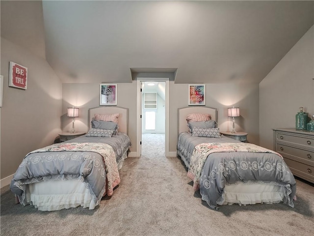 bedroom featuring light carpet and vaulted ceiling